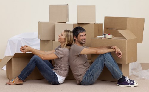 Removal team handling furniture during house removals in Waterloo