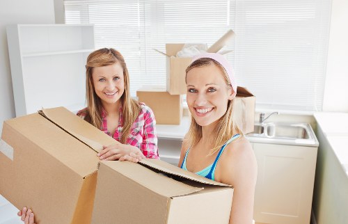House movers in Waterloo carefully loading furniture into a truck