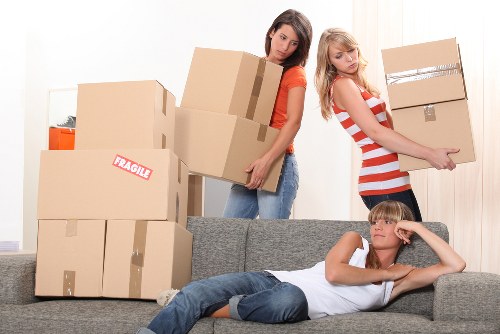 Movers handling large items with care during relocation